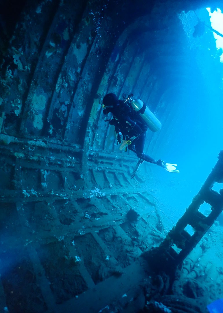 Diver inside a wreck corridor, Rabaul